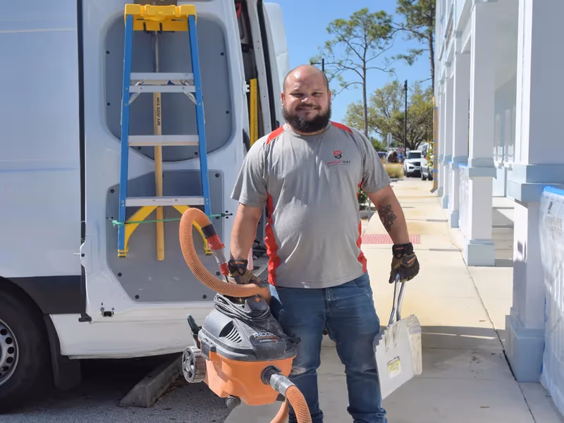 WrightWay technician with tools at service van
